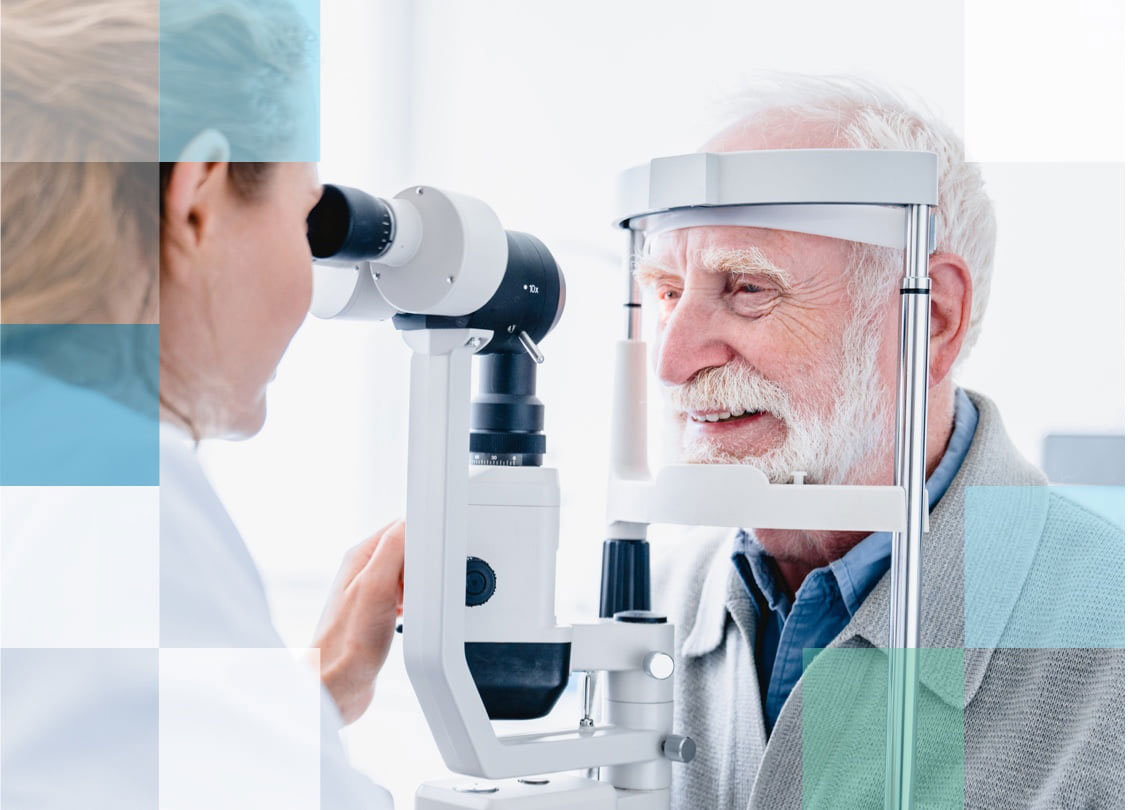 Eye care professional examining the eyes of a patient.
